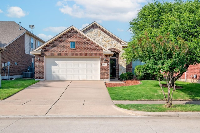 4017 Summerhill Ln, Fort Worth, TX 76244 - view of front of property with concrete driveway, an attached garage, a front lawn, and brick siding
