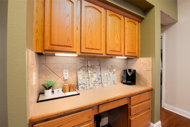 4017 Summerhill Ln, Fort Worth, TX 76244 - kitchen featuring decorative backsplash, light countertops, dark wood-style floors, and baseboards