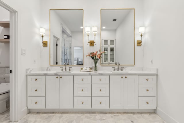 4162 Allencrest Ln, Dallas, TX 75244 - bathroom with double vanity, toilet, baseboards, and recessed lighting