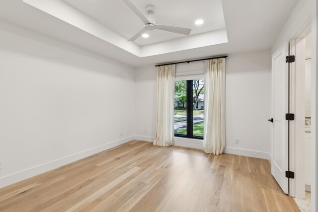 4162 Allencrest Ln, Dallas, TX 75244 - unfurnished room featuring a tray ceiling, baseboards, light wood finished floors, ceiling fan, and recessed lighting