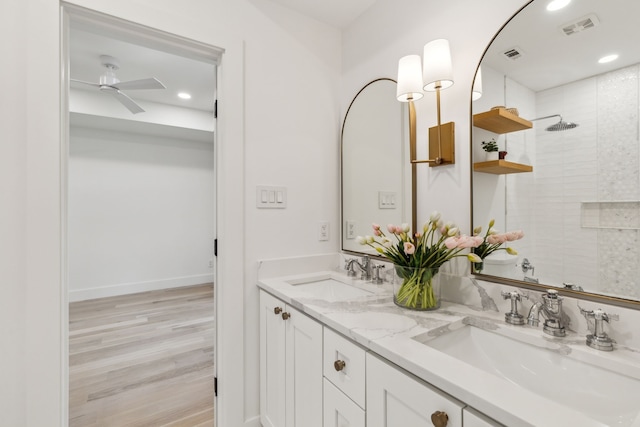 4162 Allencrest Ln, Dallas, TX 75244 - full bathroom featuring double vanity, wood finished floors, a ceiling fan, tiled shower, and recessed lighting