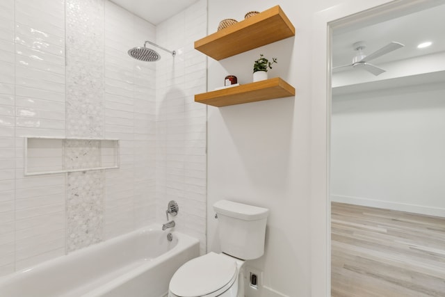 4162 Allencrest Ln, Dallas, TX 75244 - bathroom featuring toilet, washtub / shower combination, wood finished floors, a ceiling fan, and baseboards