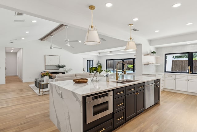 4162 Allencrest Ln, Dallas, TX 75244 - kitchen with a sink, light wood-type flooring, open shelves, an island with sink, and open floor plan