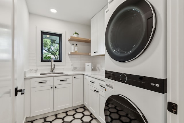 4162 Allencrest Ln, Dallas, TX 75244 - washroom with stacked washer / dryer, cabinet space, and recessed lighting