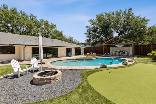 4162 Allencrest Ln, Dallas, TX 75244 - view of pool with an outdoor fire pit, a putting area, a fenced backyard, a patio area, and a gazebo