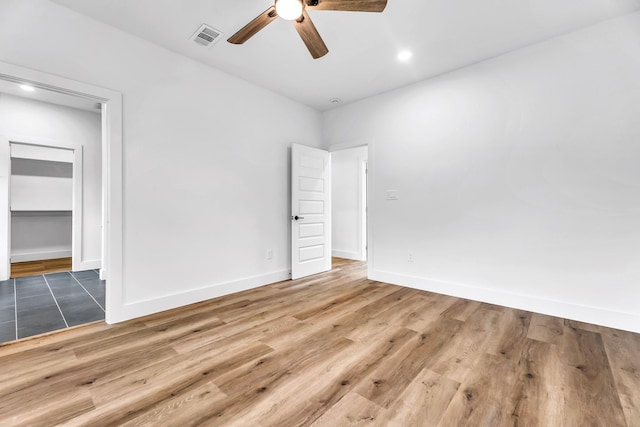 4017 Carl St, Dallas, TX 75210 - unfurnished bedroom with wood finished floors, baseboards, ceiling fan, and recessed lighting
