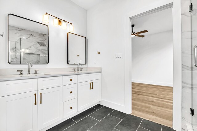 4017 Carl St, Dallas, TX 75210 - full bathroom with a marble finish shower, ceiling fan, double vanity, tile patterned flooring, and baseboards