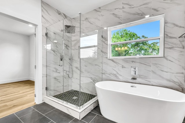 4017 Carl St, Dallas, TX 75210 - bathroom with a freestanding bath and a marble finish shower