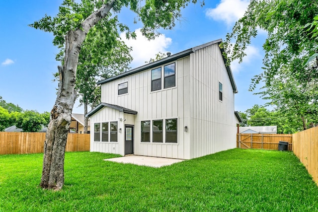 4017 Carl St, Dallas, TX 75210 - back of property featuring board and batten siding and a patio area