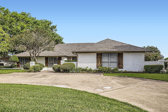 8 Canyon Ridge Dr, Fate, TX 75087 - view of front of home featuring a front lawn, brick siding, and a shingled roof