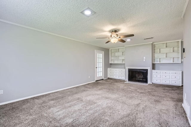 8 Canyon Ridge Dr, Fate, TX 75087 - unfurnished living room with a fireplace with flush hearth, a ceiling fan, carpet flooring, a textured ceiling, and baseboards
