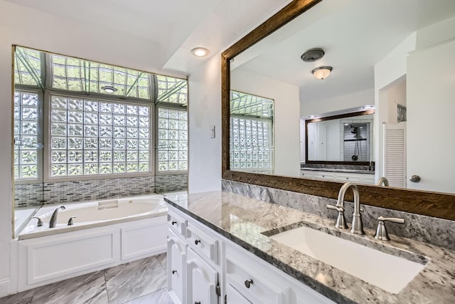 8 Canyon Ridge Dr, Fate, TX 75087 - full bathroom featuring vanity, a garden tub, a shower with shower door, and marble finish flooring