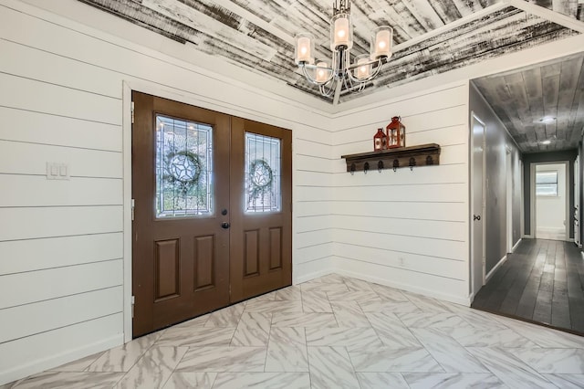 8 Canyon Ridge Dr, Fate, TX 75087 - entrance foyer with wooden ceiling, a chandelier, and wood walls