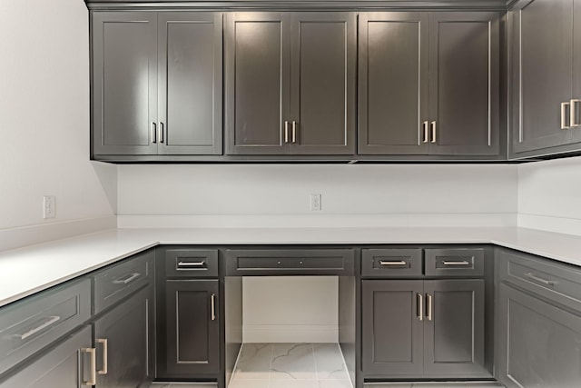 14448 Walsh, Aledo, TX 76008 - kitchen with light marble finish floors, light countertops, and gray cabinets