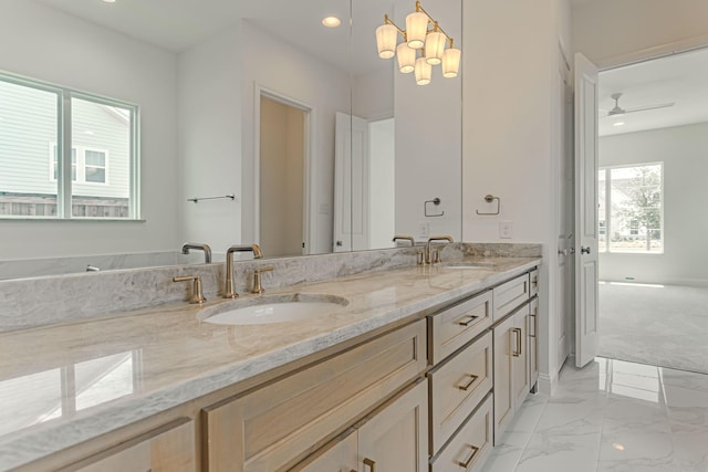 14448 Walsh, Aledo, TX 76008 - bathroom with double vanity, marble finish flooring, recessed lighting, ceiling fan, and a chandelier