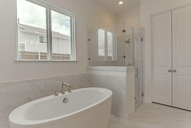 14448 Walsh, Aledo, TX 76008 - bathroom featuring a soaking tub, a marble finish shower, marble look tile flooring, and recessed lighting