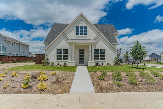 14448 Walsh, Aledo, TX 76008 - view of front facade with brick siding, roof with shingles, a standing seam roof, and metal roof