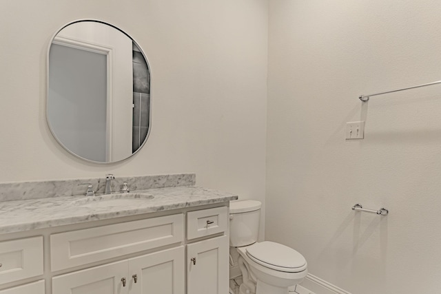 14448 Walsh, Aledo, TX 76008 - bathroom featuring toilet, vanity, and baseboards