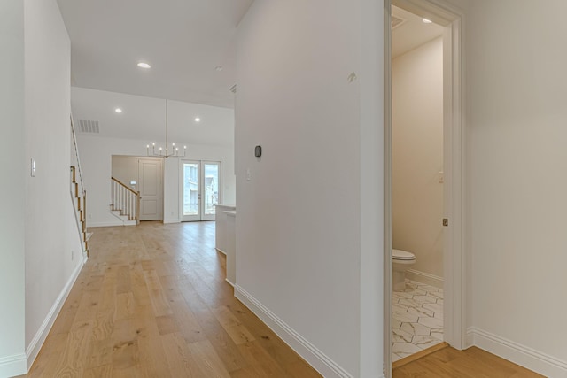 14448 Walsh, Aledo, TX 76008 - corridor featuring light wood finished floors, a chandelier, stairs, recessed lighting, and baseboards
