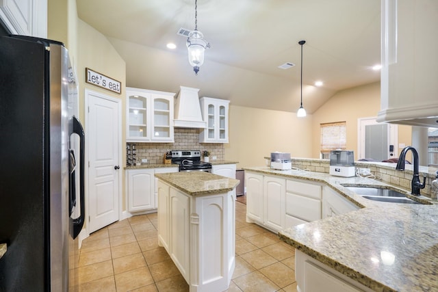 5204 Agave Way, Fort Worth, TX 76126 - kitchen featuring appliances with stainless steel finishes, a sink, custom exhaust hood, backsplash, and vaulted ceiling