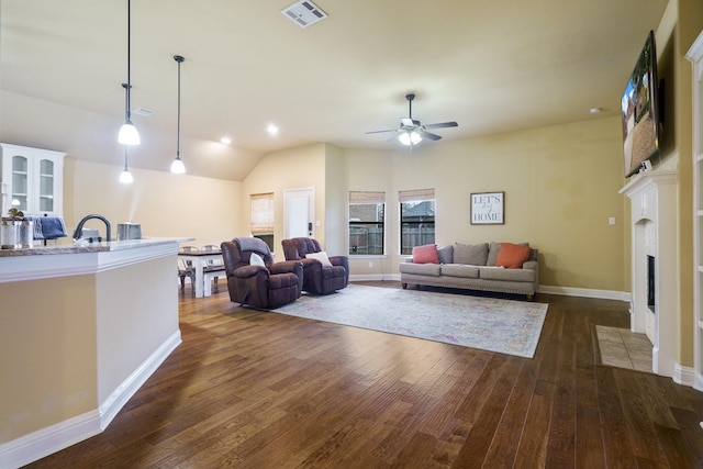 5204 Agave Way, Fort Worth, TX 76126 - living area with dark wood-style flooring, a fireplace with flush hearth, a ceiling fan, vaulted ceiling, and baseboards
