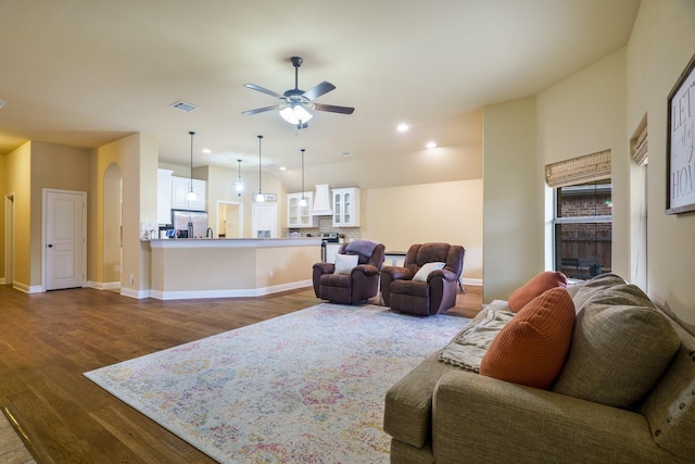 5204 Agave Way, Fort Worth, TX 76126 - living room with dark wood-type flooring, a ceiling fan, baseboards, arched walkways, and recessed lighting