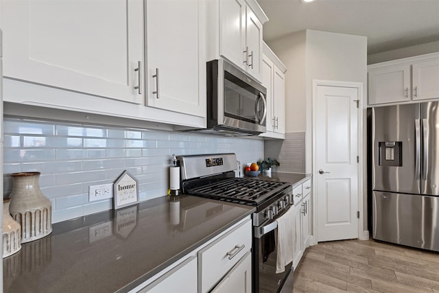 11413 Leeson St, Fort Worth, TX 76052 - kitchen with appliances with stainless steel finishes, light wood finished floors, white cabinetry, and backsplash