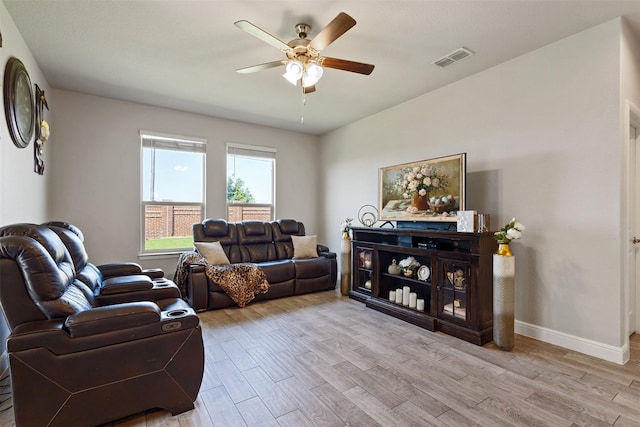 11413 Leeson St, Fort Worth, TX 76052 - living area with a ceiling fan, light wood-type flooring, and baseboards