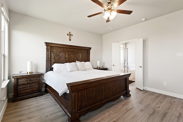 11413 Leeson St, Fort Worth, TX 76052 - bedroom featuring light wood-style floors, baseboards, ceiling fan, and ensuite bath