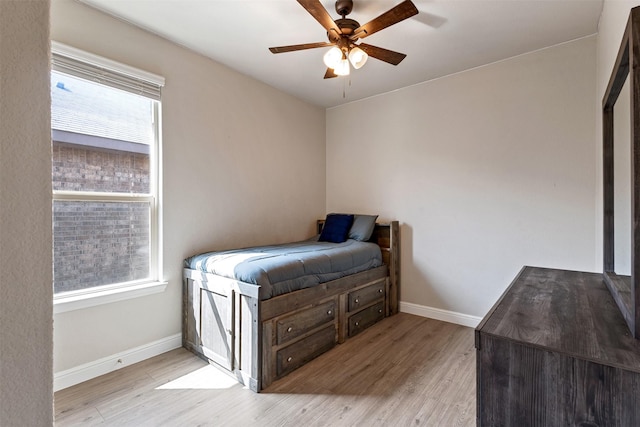 11413 Leeson St, Fort Worth, TX 76052 - bedroom with wood finished floors, multiple windows, baseboards, and a ceiling fan
