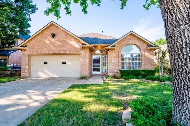833 Tablerock Way, Lewisville, TX 75077 - ranch-style house featuring brick siding, a garage, driveway, and a front lawn