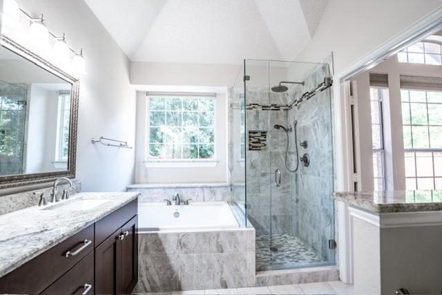 833 Tablerock Way, Lewisville, TX 75077 - full bath featuring vanity, a garden tub, lofted ceiling, a stall shower, and tile patterned floors