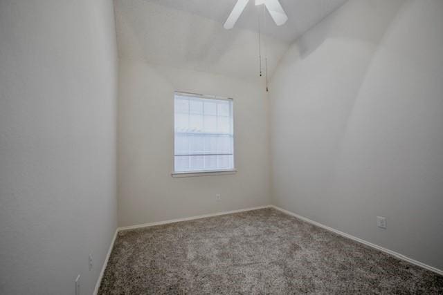 833 Tablerock Way, Lewisville, TX 75077 - carpeted empty room with ceiling fan, baseboards, and vaulted ceiling
