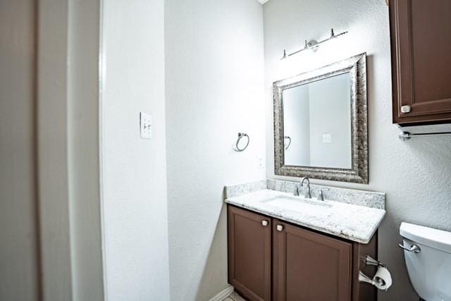 833 Tablerock Way, Lewisville, TX 75077 - bathroom with toilet and vanity