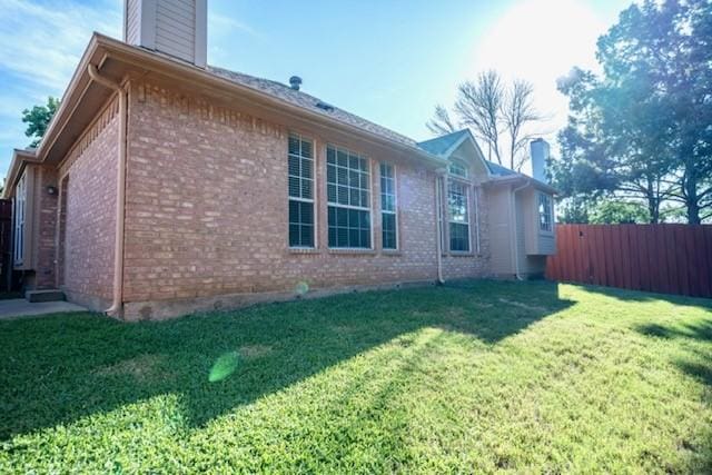 833 Tablerock Way, Lewisville, TX 75077 - view of side of property featuring a chimney and brick siding