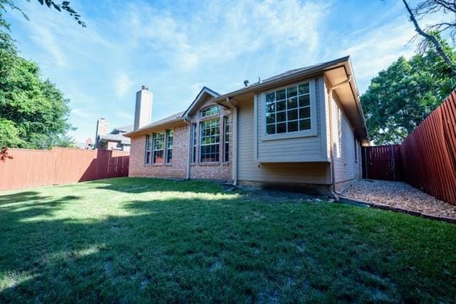 833 Tablerock Way, Lewisville, TX 75077 - back of house featuring a chimney