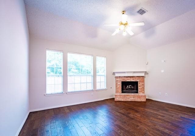 833 Tablerock Way, Lewisville, TX 75077 - unfurnished living room with ceiling fan, hardwood / wood-style flooring, baseboards, a fireplace, and lofted ceiling