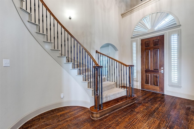 11257 Lamar Ln, Frisco, TX 75033 - entrance foyer featuring stairs, a towering ceiling, and wood finished floors