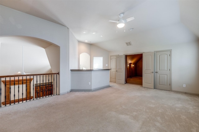 11257 Lamar Ln, Frisco, TX 75033 - spare room featuring ceiling fan, vaulted ceiling, light colored carpet, baseboards, and arched walkways