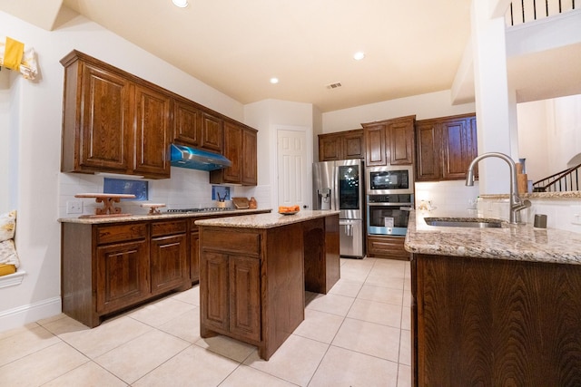 1503 Willingham Dr, Allen, TX 75013 - kitchen with a sink, stainless steel appliances, under cabinet range hood, tasteful backsplash, and recessed lighting