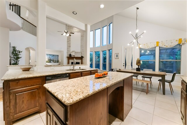 1503 Willingham Dr, Allen, TX 75013 - kitchen featuring high vaulted ceiling, a sink, a kitchen island, light tile patterned flooring, and dishwasher