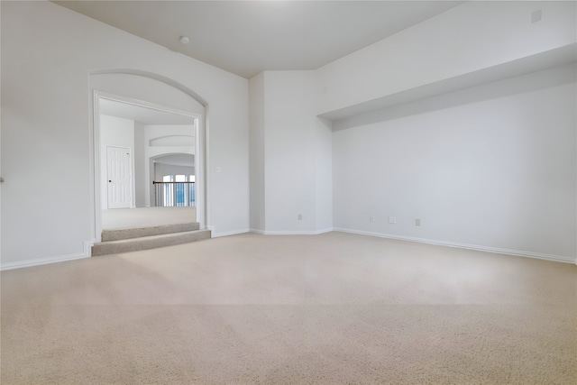 1503 Willingham Dr, Allen, TX 75013 - carpeted empty room with arched walkways, stairs, and baseboards