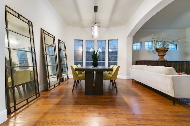 1503 Willingham Dr, Allen, TX 75013 - dining area with ornamental molding, wood finished floors, baseboards, and arched walkways