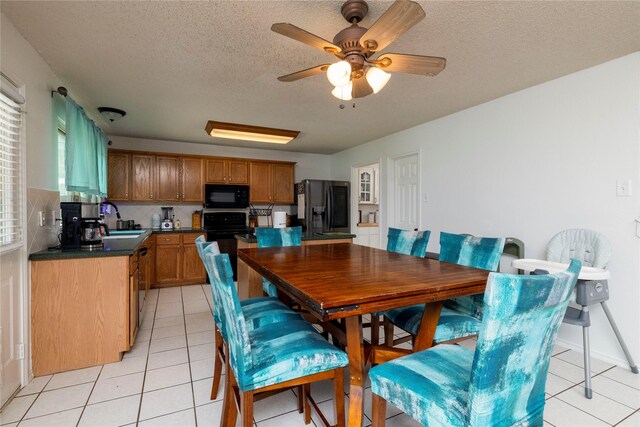 13412 Dove Ranch Rd, Fort Worth, TX 76262 - dining room featuring light tile patterned floors, a textured ceiling, and a ceiling fan