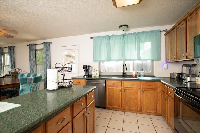 13412 Dove Ranch Rd, Fort Worth, TX 76262 - kitchen featuring black appliances, brown cabinetry, a textured ceiling, a ceiling fan, and light tile patterned flooring