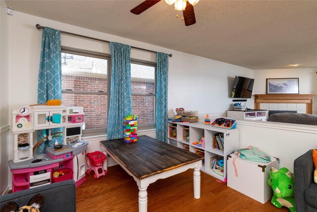 13412 Dove Ranch Rd, Fort Worth, TX 76262 - playroom with a textured ceiling, wood finished floors, and a ceiling fan