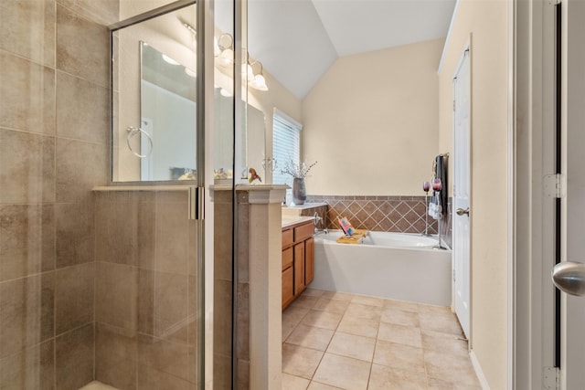 408 Castle St, Desoto, TX 75115 - full bathroom featuring vanity, tile patterned flooring, a stall shower, a garden tub, and tile walls