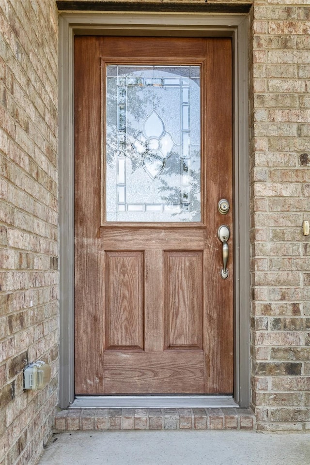 408 Castle St, Desoto, TX 75115 - doorway to property featuring brick siding