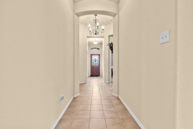 408 Castle St, Desoto, TX 75115 - corridor with light tile patterned floors, a chandelier, and baseboards