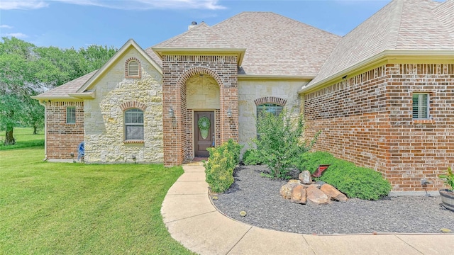 489 Roberts Run, Sherman, TX 75092 - french country inspired facade with a front lawn, stone siding, brick siding, and a shingled roof